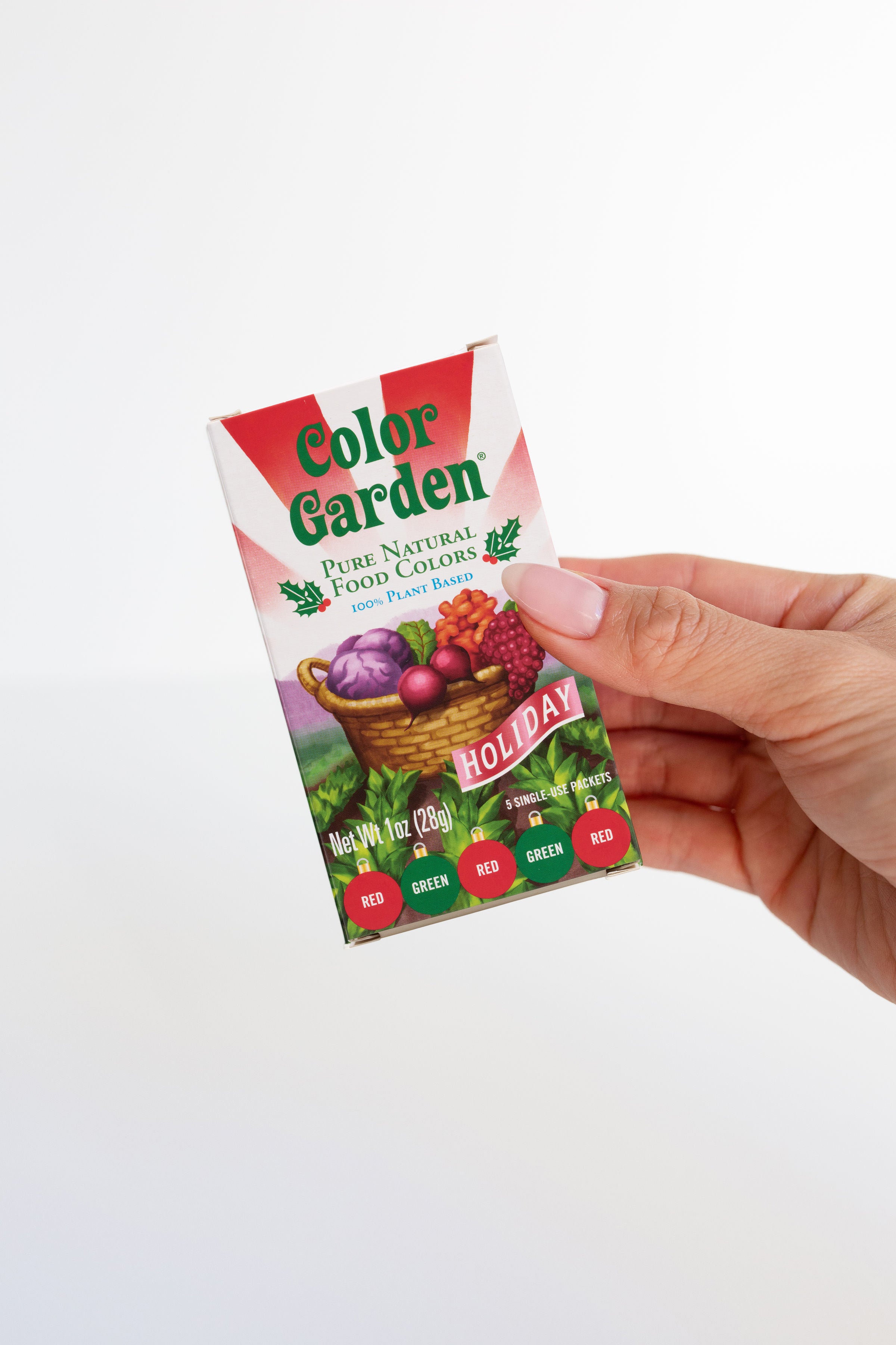 hand holding a box of color garden holiday colors